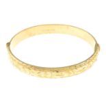 A 9ct gold hinge bangle.Hallmarks for 9ct gold.
