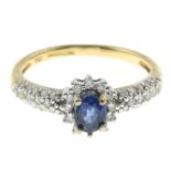 An 18ct gold sapphire and diamond cluster ring.One diamond deficient.Estimated total diamond weight