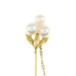 A cultured pearl stickpin.Stamped K18.Length of stickpin head 1.9cms.