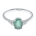 An emerald and diamond dress ring.Emerald weight 0.85ct,
