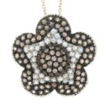 A cubic zirconia flower pendant on chain.Stamped 750.