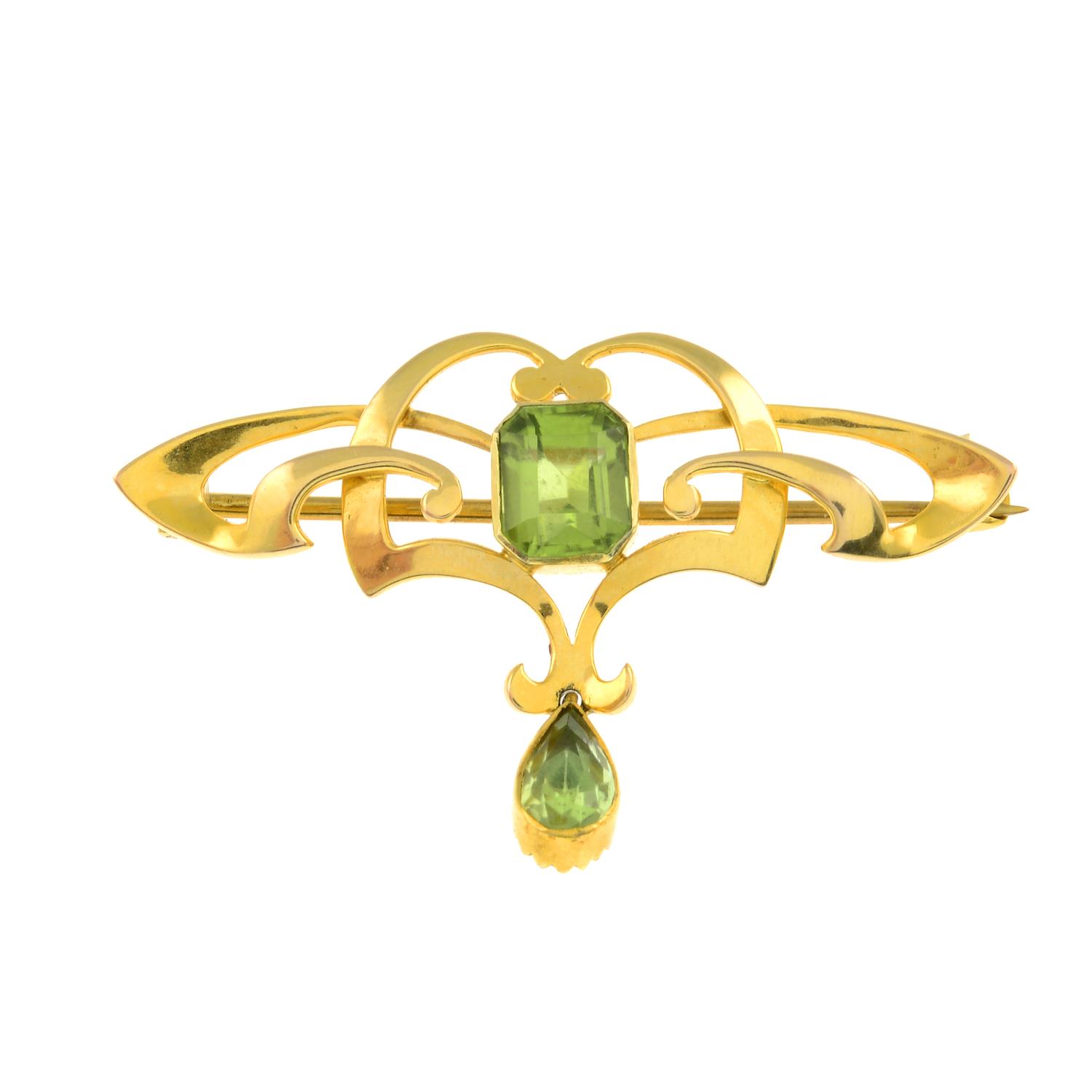 An early 20th century 15ct gold peridot brooch.Stamped 15CT.