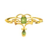 An early 20th century 15ct gold peridot brooch.Stamped 15CT.