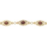 9ct gold garnet bracelet, hallmarks for 9ct gold, length 19.5cms, 8.2gms.