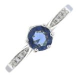 A diamond and blue cubic zirconia ring.Total diamond weight 0.04ct, stamped to band.