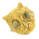 A textured dress ring, depicting an owl head, with chrysoberyl eye detail.Ring size J1/2.