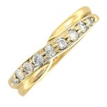 An 18ct gold diamond ring.Total diamond weight 0.25ct, stamped to band.