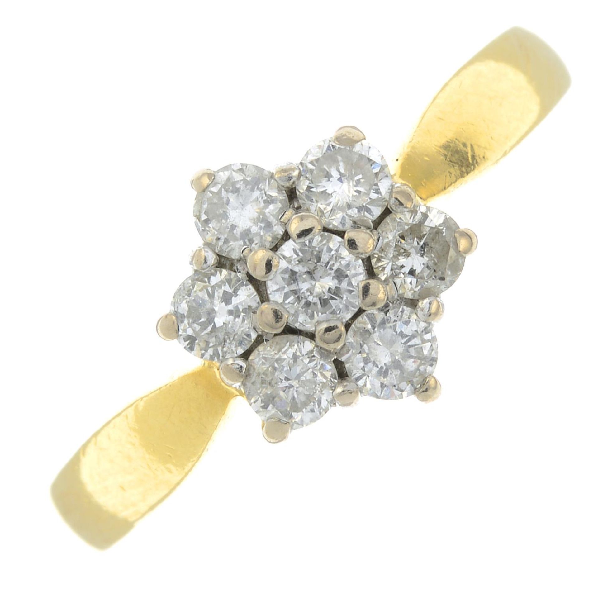 An 18ct gold diamond cluster ring.Estimated total diamond weight 0.50ct.
