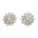 A pair of diamond cluster earrings.Estimated total diamond weight 1ct.