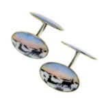 Textured oval cufflinks, stamped 750, lengths of cufflink faces 1.7 and 2.2cms, 7gms.