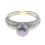 A cultured pearl and diamond ring.Cultured pearl measuring approximately 7mms.Stamped 750 PT.Ring