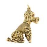 A 9ct gold poodle dog pendant, with synthetic ruby eye highlights.Hallmarks for 9ct gold.