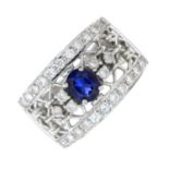 A synthetic sapphire and cubic zirconia dress ring.Ring size R.