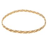 A 9ct gold bangle.Hallmarks for Sheffield.Inner diameter 6.5cms.