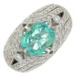 An emerald and diamond dress ring.