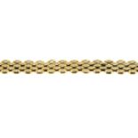 A 9ct gold brick-link bracelet.Import marks for 9ct gold.