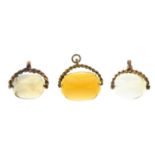 Two 9ct gold citrine fobs, hallmarks for 9ct gold, lengths 2.5 and 2.7cms, total weight 19.1gms.