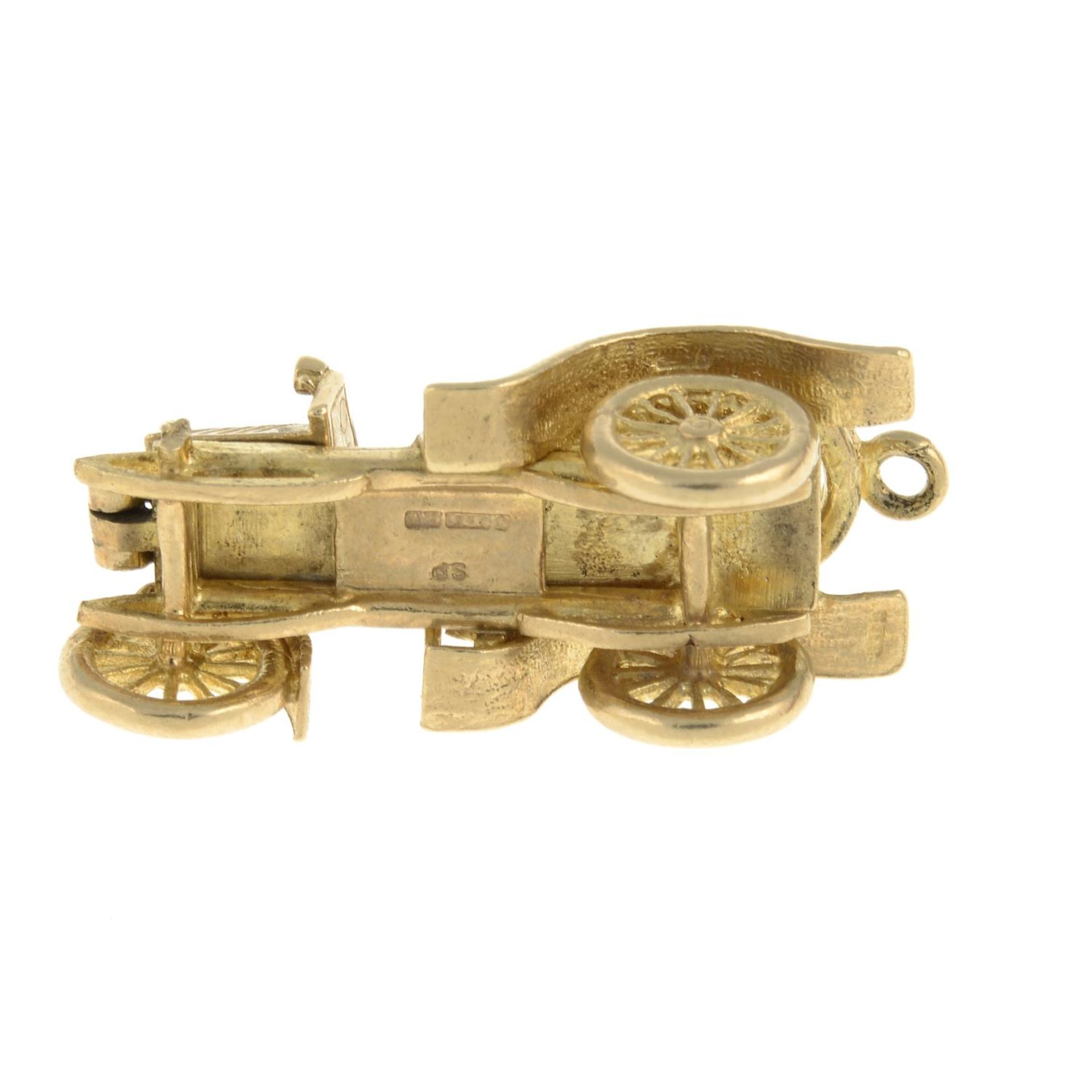 A 9ct gold charm, designed as a vintage car, open to reveal engines.Hallmarks for 9ct gold. - Image 3 of 3