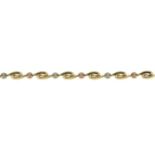 A 9ct gold tri-colour fancy-link bracelet.Hallmarks for 9ct gold.