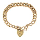 A curb-link bracelet, gathered at a heart-shape padlock clasp.