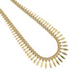 A 9ct gold fringe necklace.Hallmarks for 9ct gold.