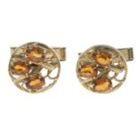 A pair of 9ct gold citrine cufflinks, each depicting a floral motif.Hallmarks for 9ct gold.