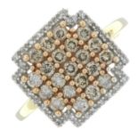 A 9ct gold diamond and 'brown' diamond dress ring.Estimated total diamond and 'brown' diamond