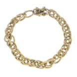 A mid 20th century bracelet.Stamped 18ct.Length 19cms.