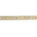 A 9ct gold bi-colour fancy-link bracelet.Import marks for 9ct gold.