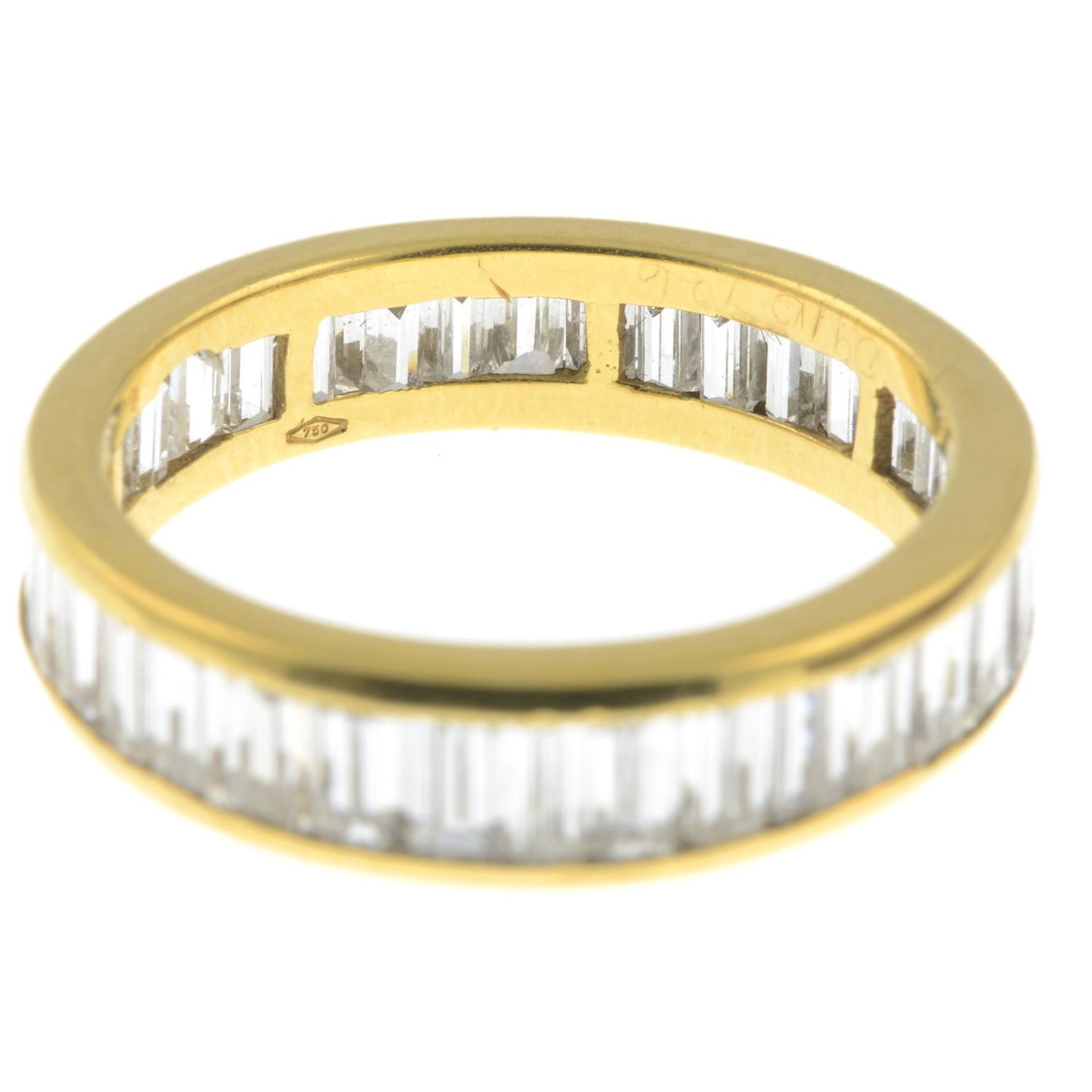 A baguette-cut diamond full eternity ring.Estimated total diamond 3 to 3.50cts. - Image 2 of 2
