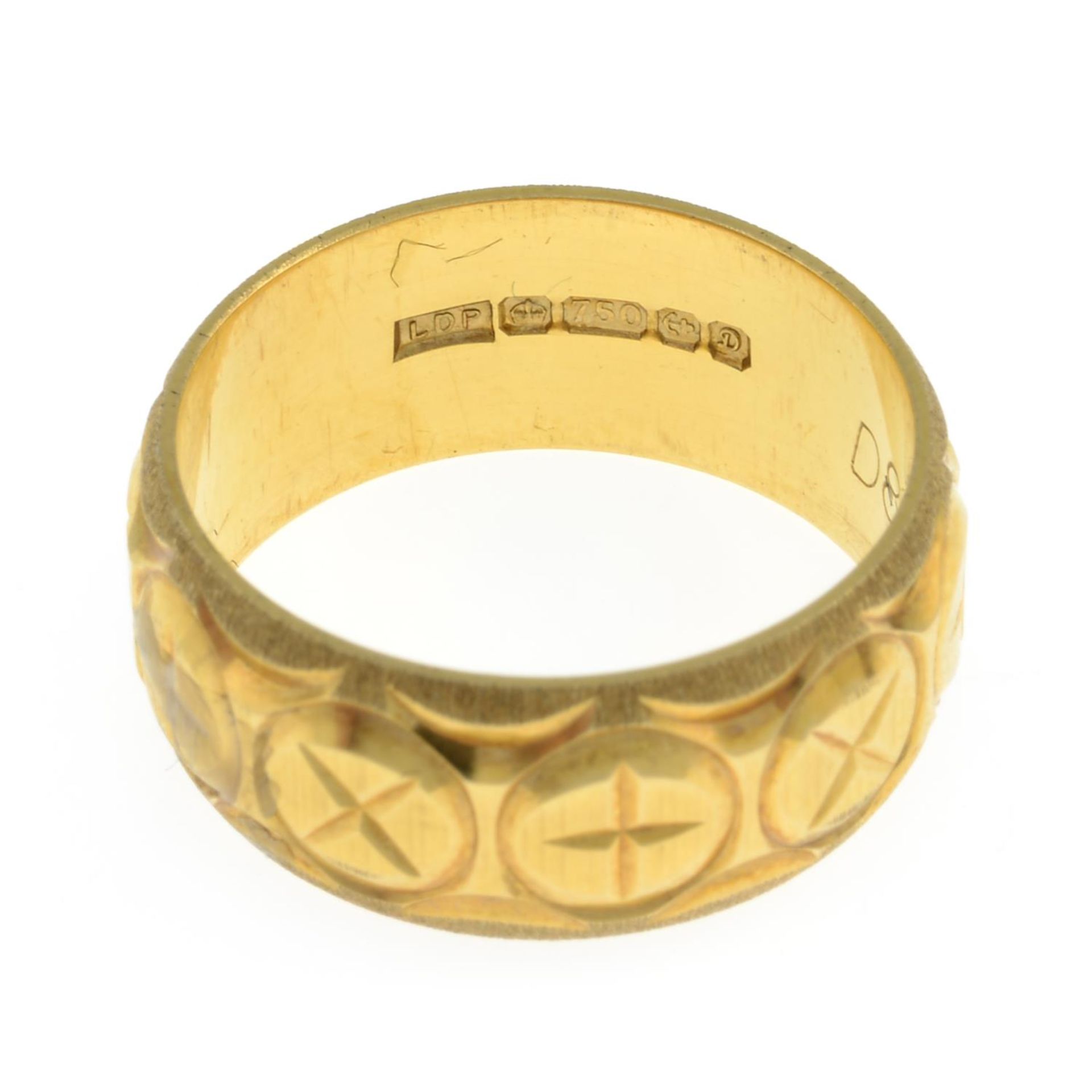 An 18ct gold engraved band ring.Hallmarks for Birmingham, 1978.Ring size M. - Image 2 of 2