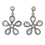 A pair of blue topaz and diamond floral drop earrings.Length 1.7cms.