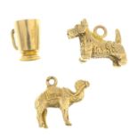 Four 9ct gold charms, hallmarks for 9ct gold, lengths 1 to 1.5cms, 5.7gms.