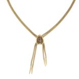 A 9ct gold two-row fringe necklace, gathered at a ruby pendant.Hallmarks for 9ct gold.