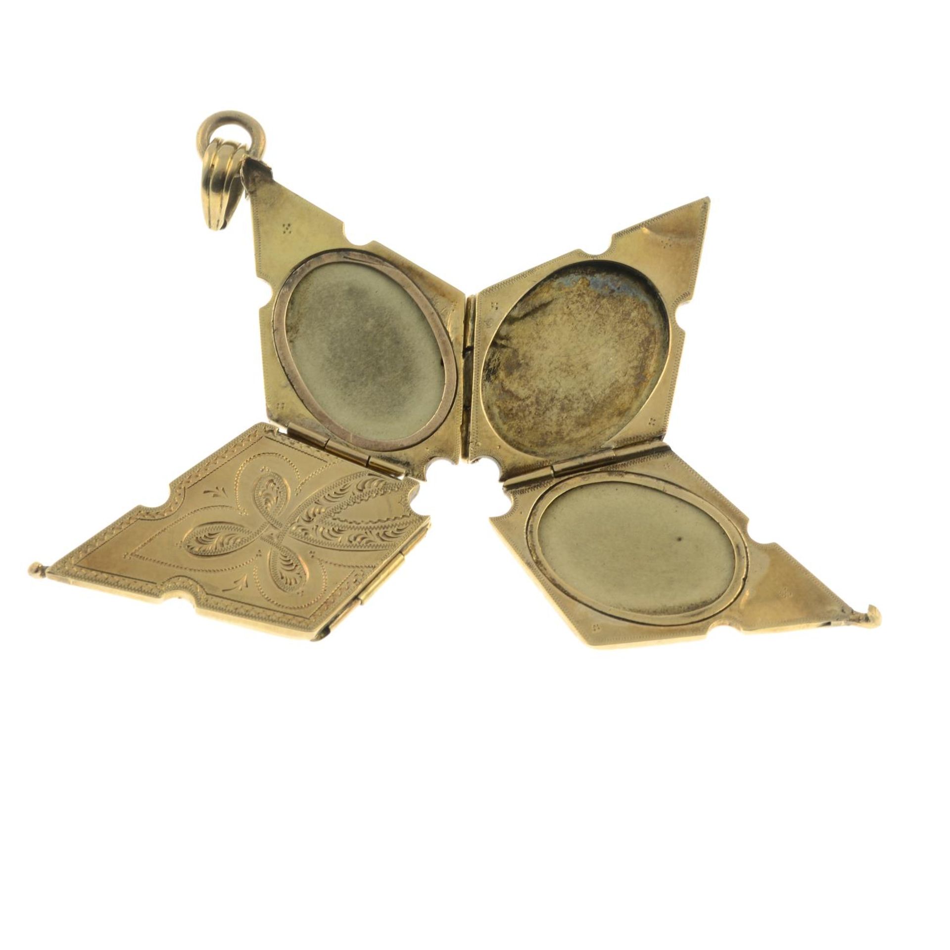 An early 20th century locket, unfurling to reveal star, with oval-shape vacant panels.Length 4cms. - Image 2 of 4