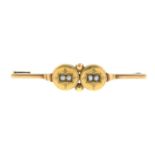A late 19th century split pearl accent bar brooch.Marks partially indistinct.