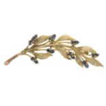 A 9ct gold sapphire floral spray brooch.Hallmarks for 9ct gold.