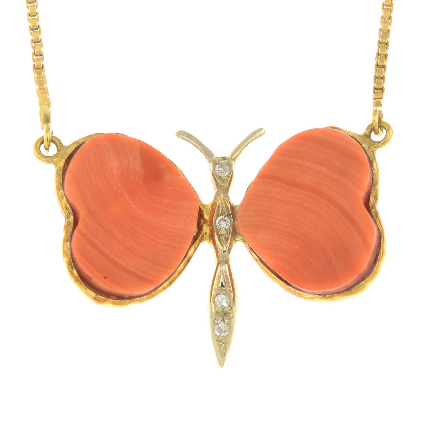 A butterfly necklace, with coral wings and diamond accent body.Stamped 750.