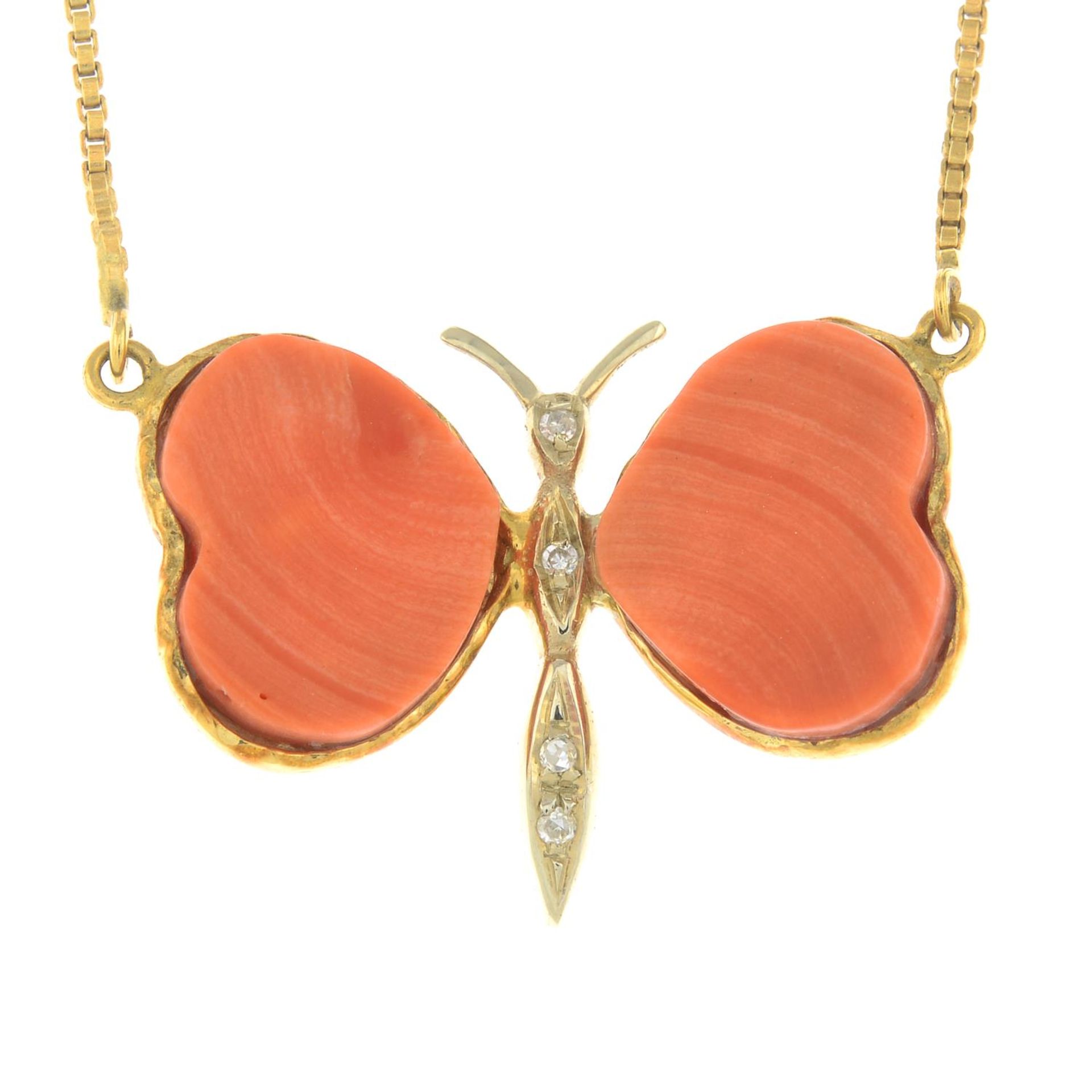 A butterfly necklace, with coral wings and diamond accent body.Stamped 750.