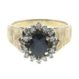 A 9ct gold sapphire and diamond cluster ring.Estimated total diamond weight 0.15ct.