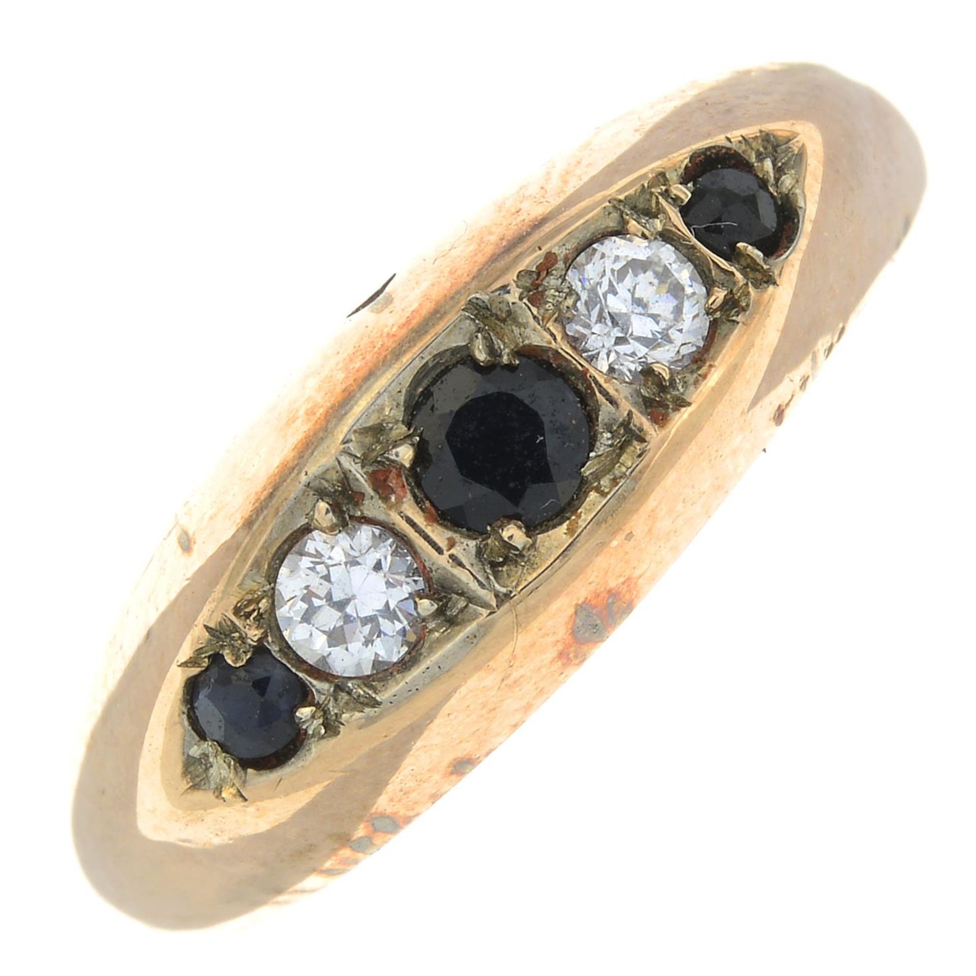 A sapphire and cubic zirconia five-stone ring.Band replacement with hallmarks for 9ct gold.