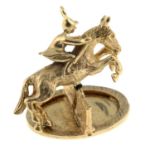 A 9ct gold horse jumping pendant.Hallmarks for 9ct gold.