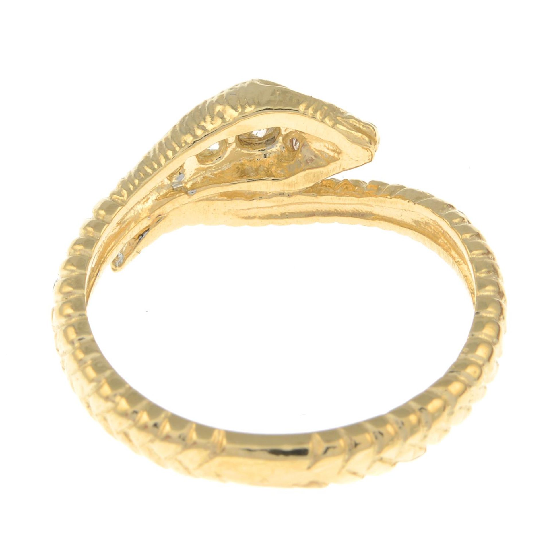 A dress ring, designed as a coiled snake, with diamond crest and eyes. - Image 2 of 3