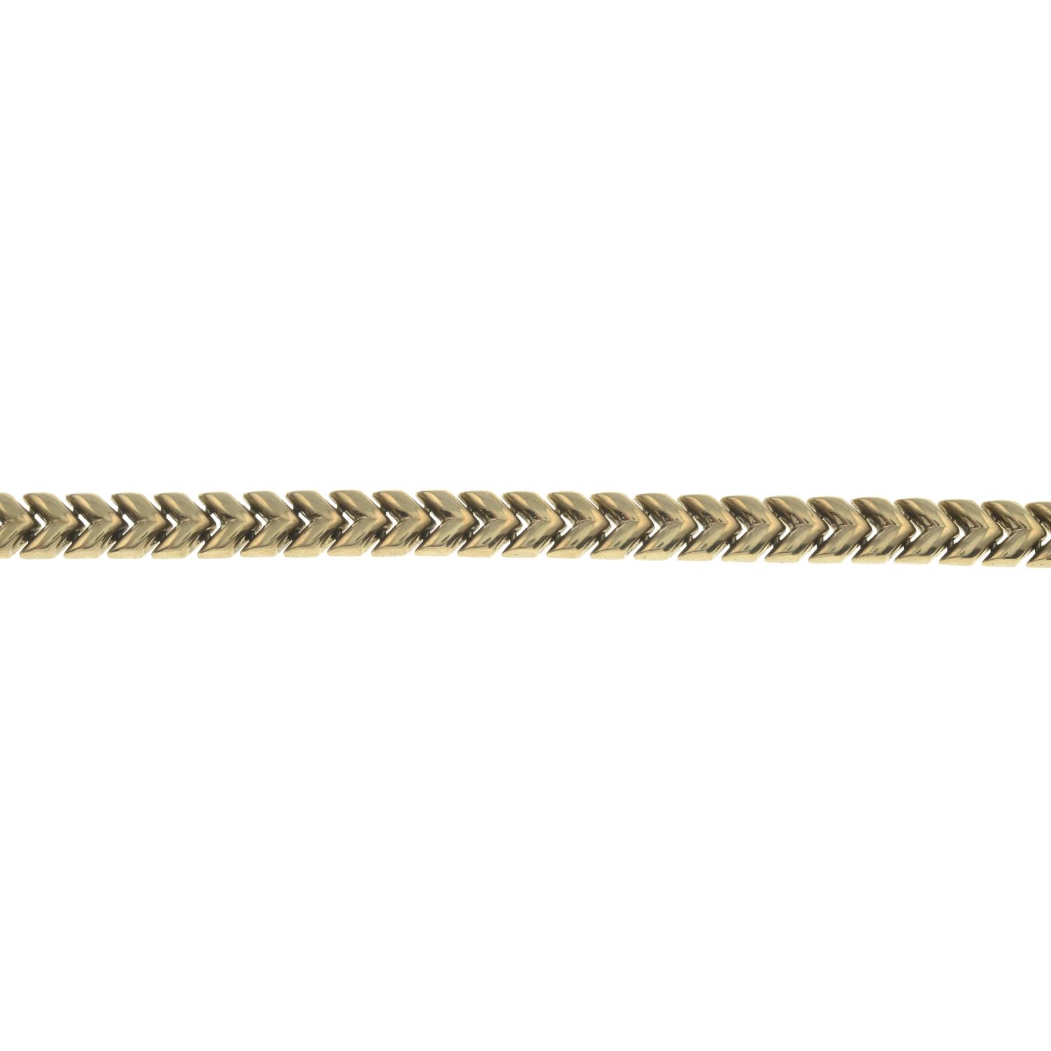 A chevron-link bracelet.Stamped 375.