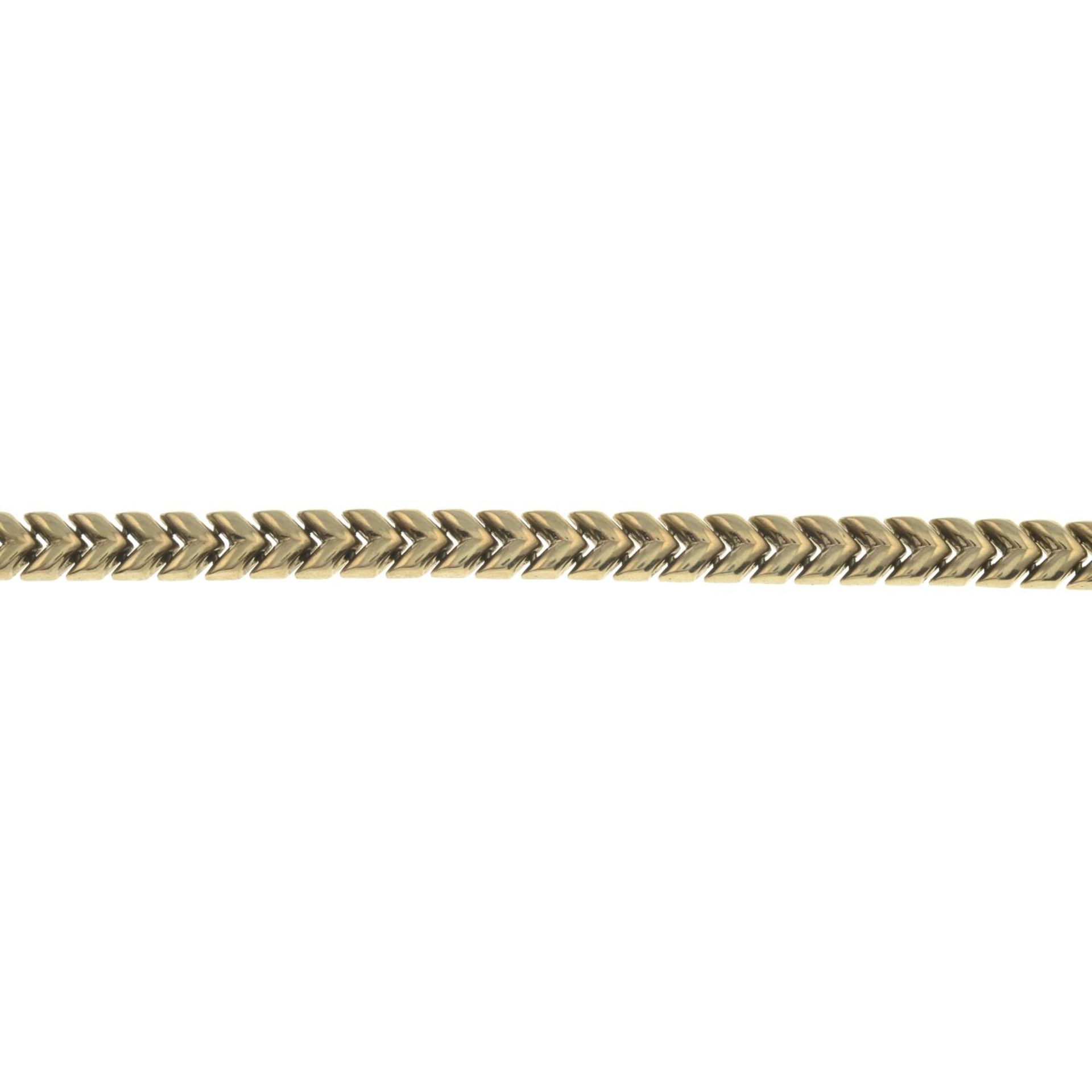 A chevron-link bracelet.Stamped 375.