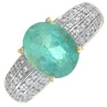 An 18ct gold emerald and brilliant-cut diamond dress ring.Emerald calculated weight 2.61cts,