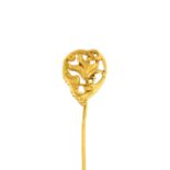 An early 20th century gold foliate stickpin.French assay marks.Length of stickpin head 1.3cms.