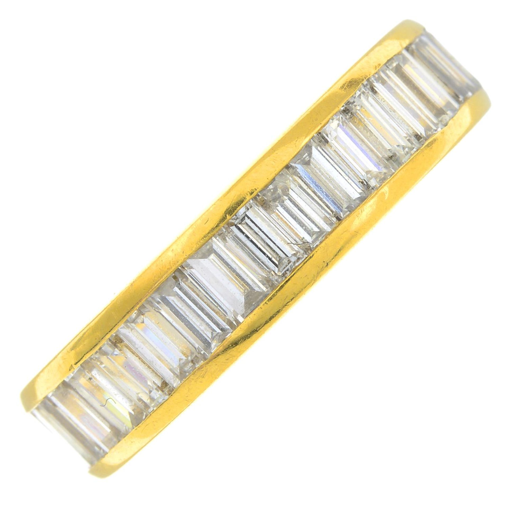 A baguette-cut diamond full eternity ring.Estimated total diamond 3 to 3.50cts.
