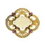 A 9ct gold opal and ruby brooch.Opal estimated dimensions 18 by 13 by 5.3mms.
