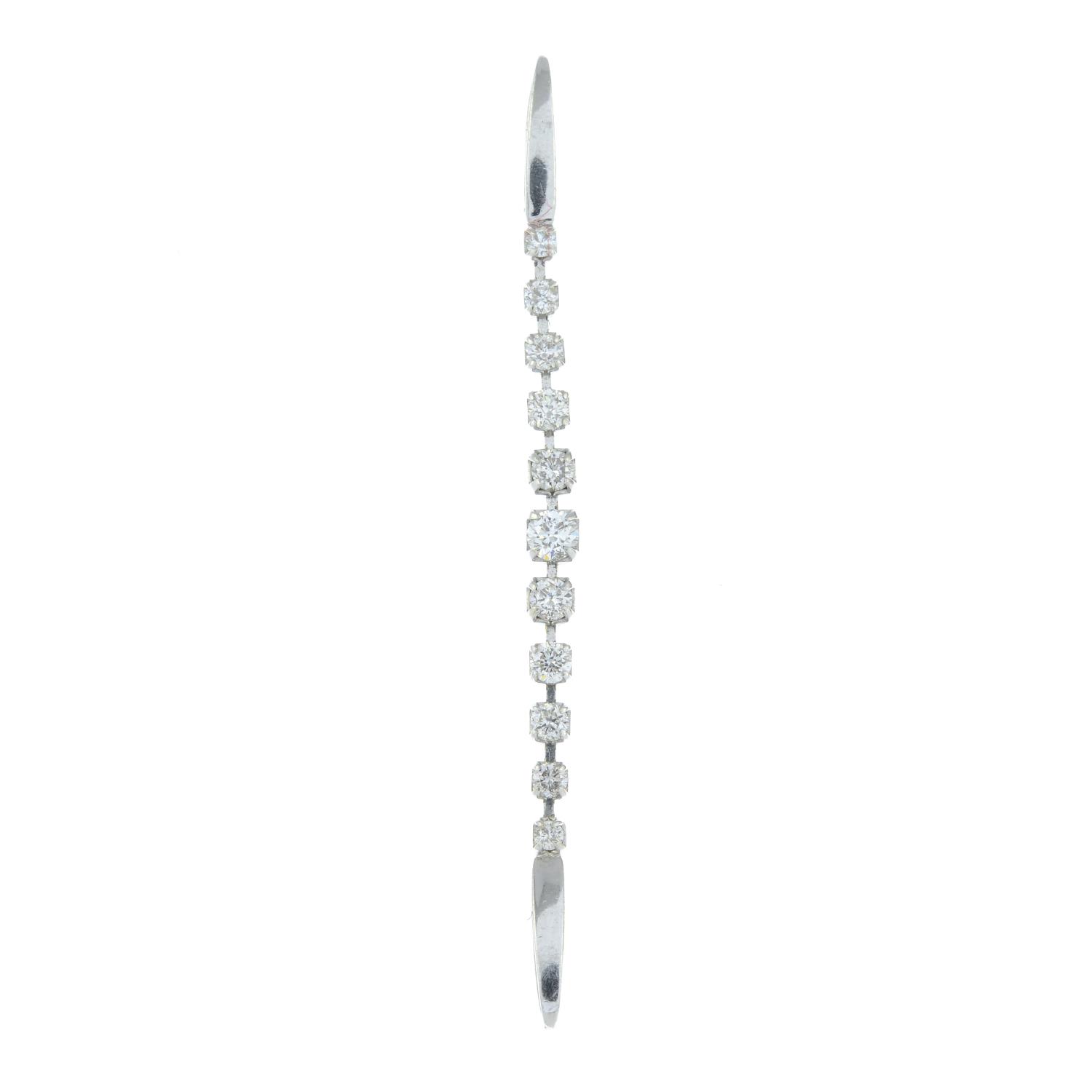 A diamond line pendant.Total diamond weight 0.50ct, stamped to mount.